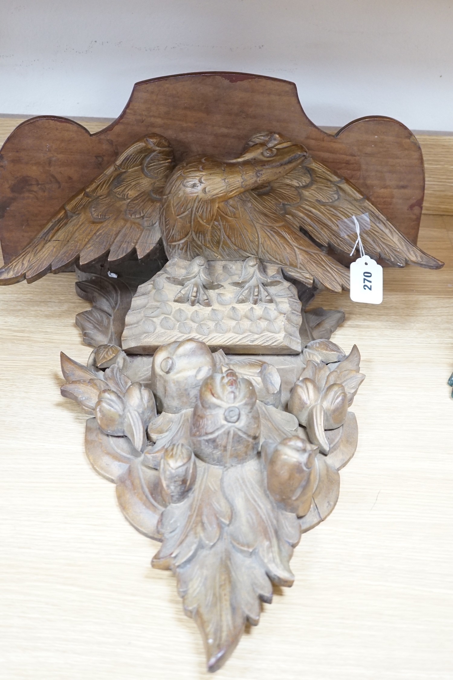 A carved gilt wood ‘eagle’ wall bracket, 62cm long